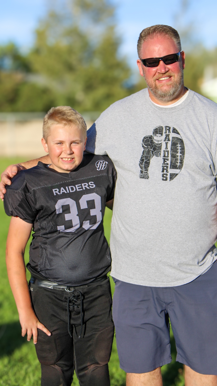 Father and son Raiders football portrait