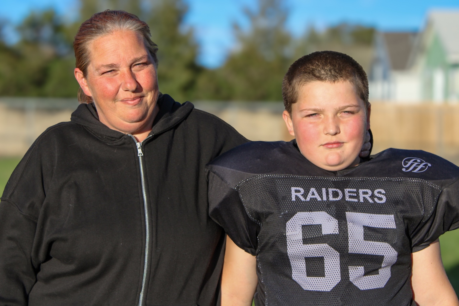 Mother with youth football player